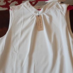 Cream colored blouse brand new with tags
